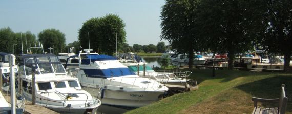 Boats moored up at Newark Marina on a sunny summer day.