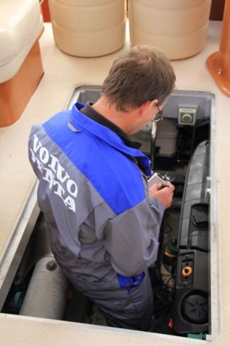Volvo Penta Engineer looking at boat engine