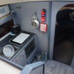 Fairline Turbo 36 - Steps down into the galley