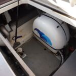 Aquador 32 -Lazarette with generator, cockpit table and batteries.