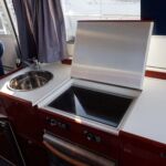 Aquador 32 - Stainless steel sink with mixer tap and Wallas Diesel hob, oven and fridge.