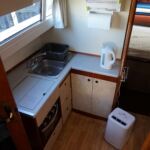 Birchwood 35 Sportsman - Steps down into the Galley & Dinette