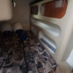 Rinker Fiesta V270 - Midships double berth with storage space
