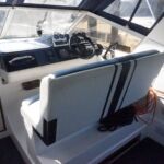 Fairline Carrera 24 - Double helmseat flips back to make cockpit seating