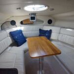 Regal 2665 Commodore - Saloon with dining table