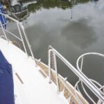 Broom 345 - Walk around deck with steps down to the bathing platform