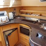 Haine 350 - Galley with hob, oven, fridge and sink unit