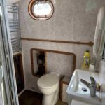 Heads with toilet, wash hand basin, shower cubicle and hairdryer