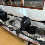 Two padded seats and middle spare seat