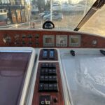 Broom 415 - Well presented helm area with switches, gauges and chart table easily accessible.