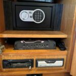 Broom 415 - Electronic equipment stored in the sideboard cupboard