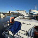 Mitchell 31 - Stern fender baskets and aft canopy cover