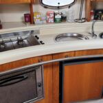 Hardy Seawings 355 - Galley comprises of hob, oven, fridge and sink with mixer tap.