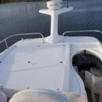 Sealine F34 - Flybridge sunpad (cushions stored inside) and hinged radar wing